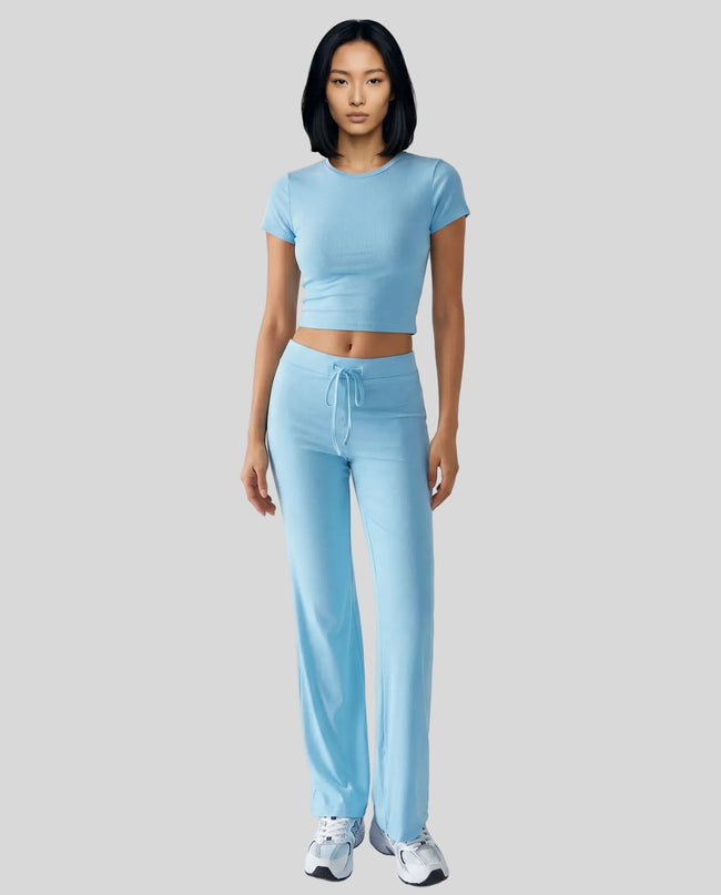Model front view wearing pastel blue Athlesi SoftForm short sleeve lounge set