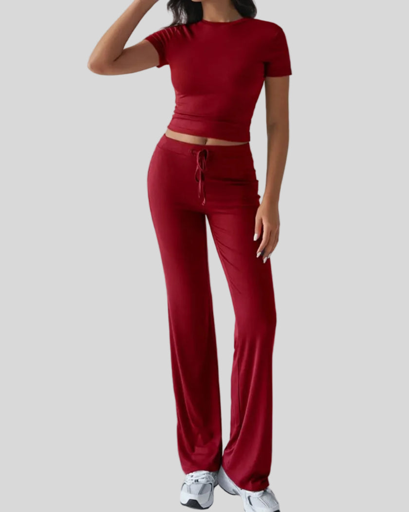 Front angled view of model wearing rust Athlesi SoftForm lounge set
