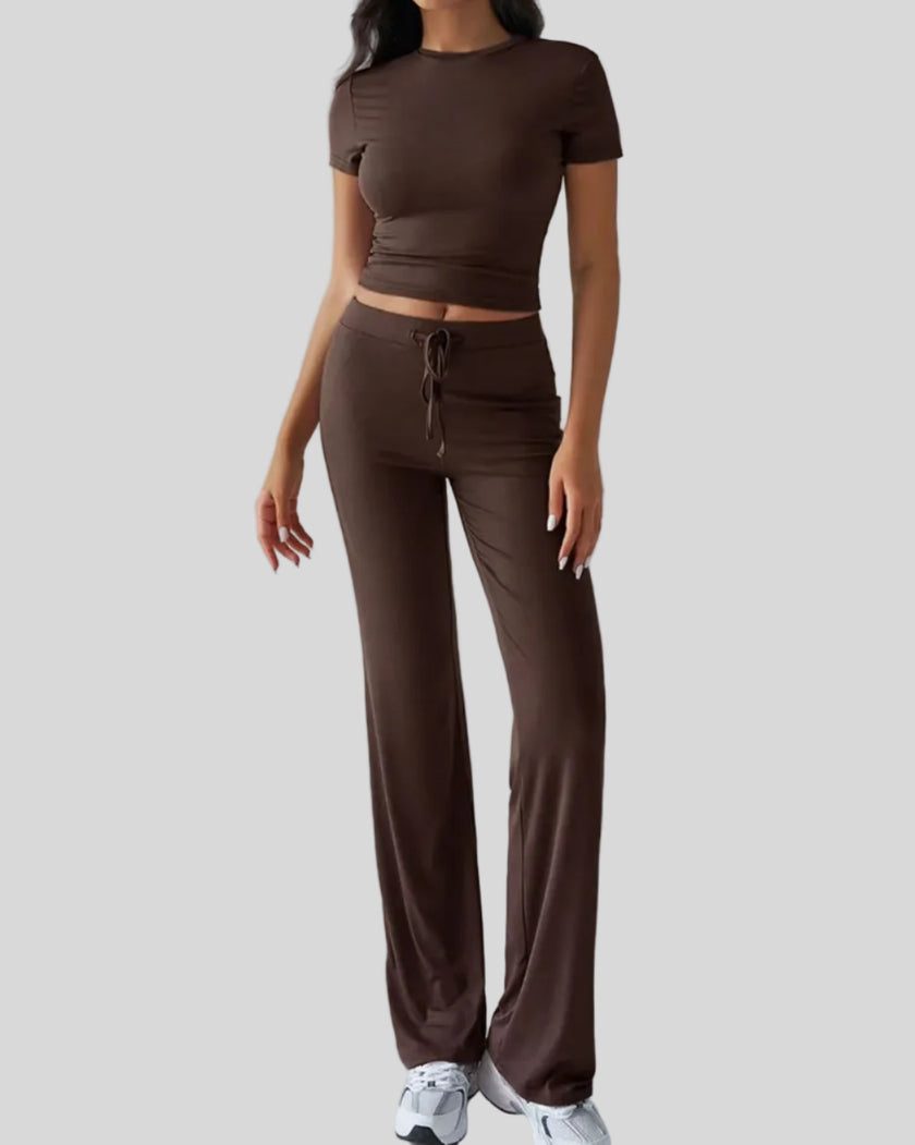 Model wearing brown Athlesi SoftForm short sleeve top and pant set front view