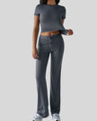 Model wearing dark gray Athlesi SoftForm short sleeve top and pant set front view