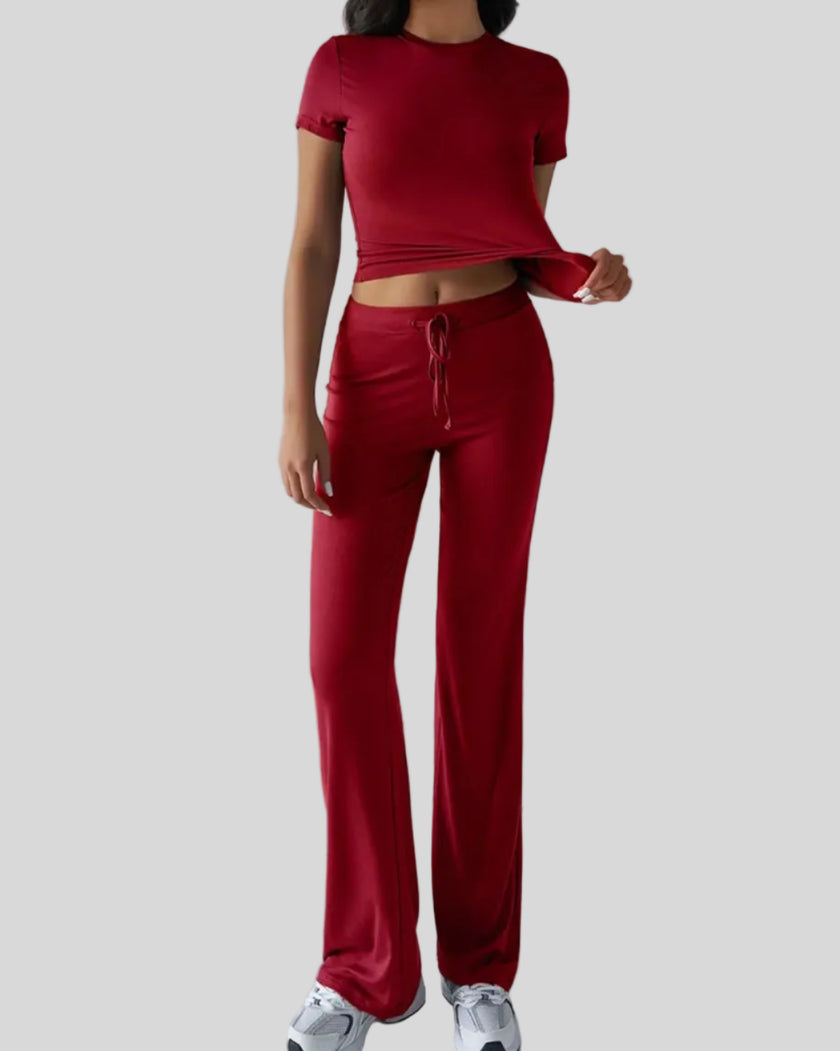 Model wearing rust Athlesi SoftForm short sleeve top and pant set front view