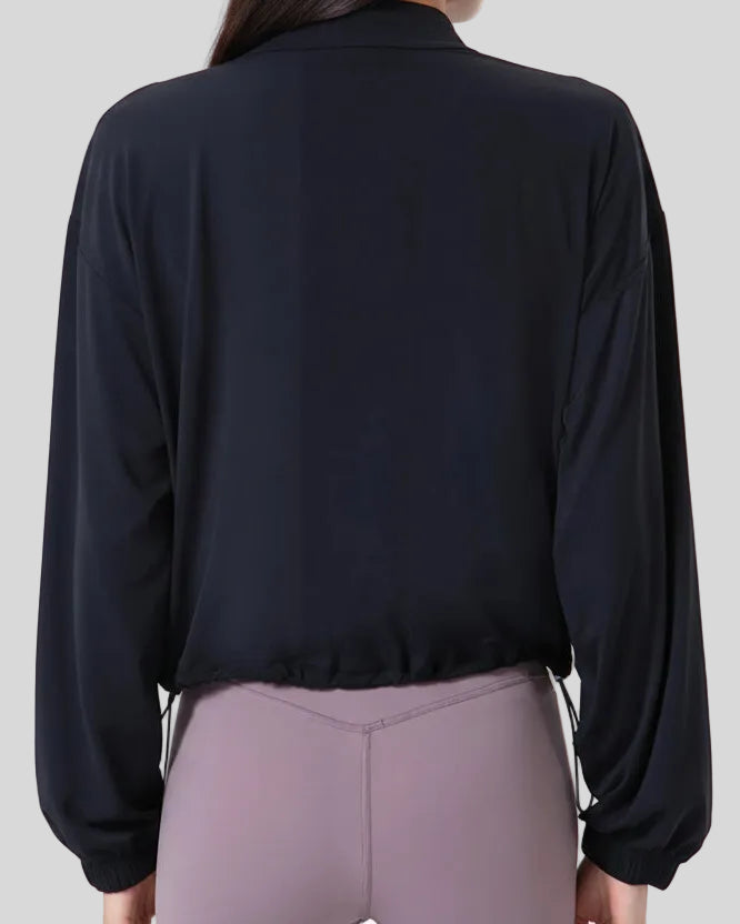 Close-up back detail of SoftForm Zip Active Jacket in black