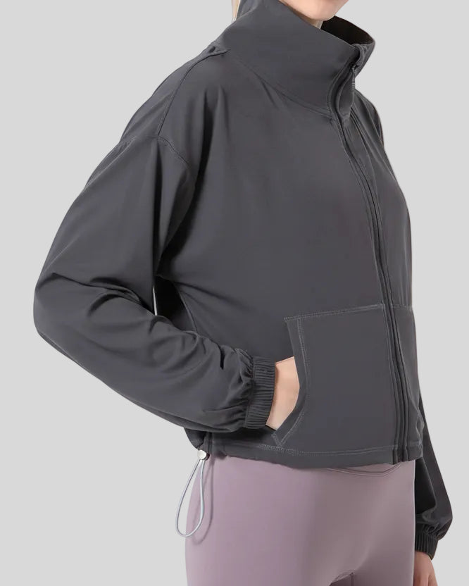 Close-up left side view of SoftForm Zip Active Jacket in dark gray