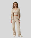 Woman wearing the SoftNest Lounge Set in beige front view with V-neck tank cardigan and relaxed pants