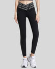 Front angle view of Statement Angel Legging in black, showing bold waistband detail