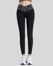Front view of Statement Angel Legging in black with slogan waistband