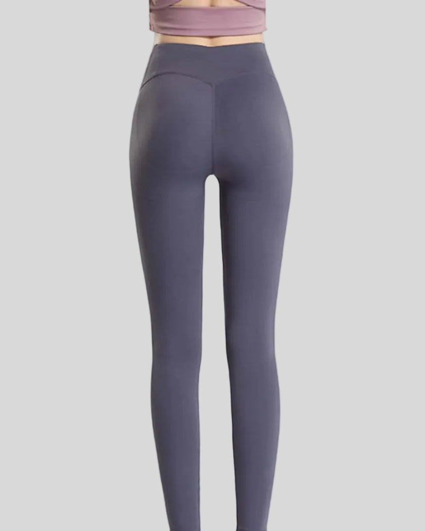 Back angle view of dark gray Statement Angel Legging with cropped sporty fit