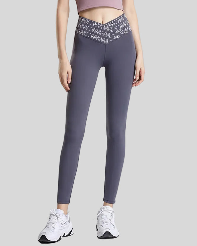Front view of Statement Angel Legging in dark gray with slogan waistband