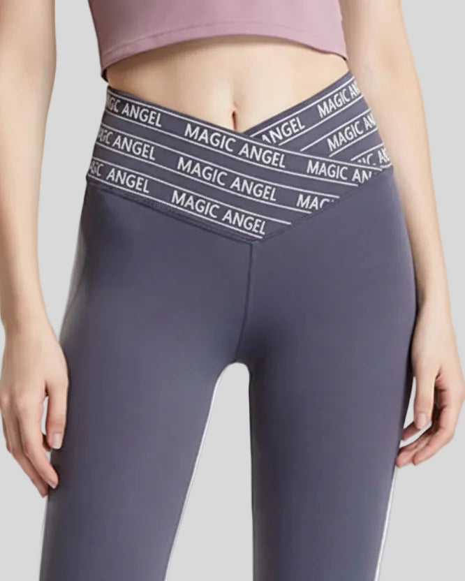 Closeup of “Magic Angel” slogan waistband on Statement Angel Legging in dark gray