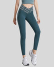 Front angle view of Statement Angel Legging in deep teal, showing bold waistband detail