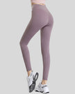 Back angle view of mauve Statement Angel Legging with cropped sporty fit