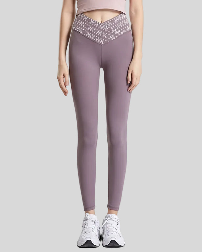 Front view of Statement Angel Legging in mauve with slogan waistband