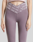 Closeup of “Magic Angel” slogan waistband on Statement Angel Legging in mauve