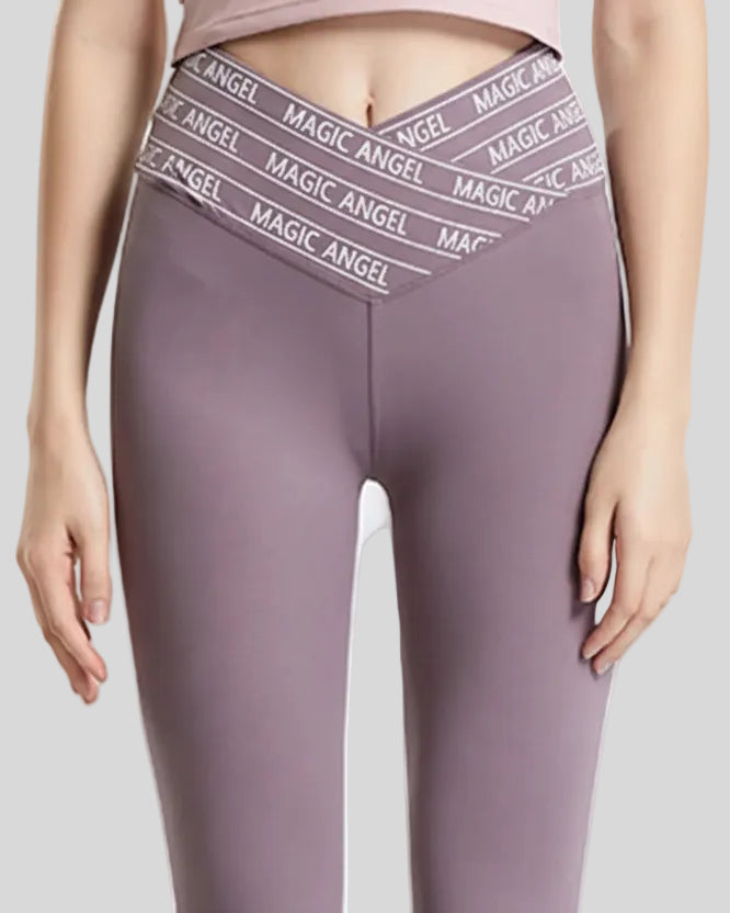 Closeup of “Magic Angel” slogan waistband on Statement Angel Legging in mauve