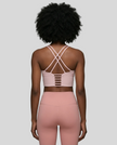 Back view of blush pink ladder strap sports bra with Athlesi pink leggings