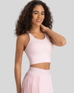Angled front view of blush pink ladder back longline sports bra Athlesi