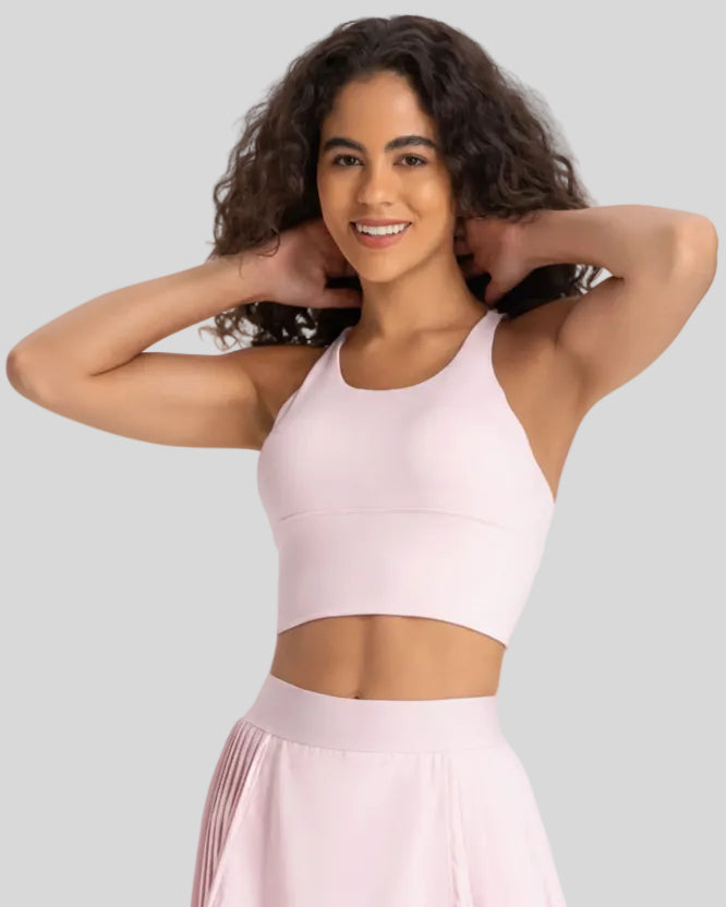 StrataLuxe ladder back sports bra in blush pink front view longline design