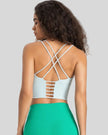 Back view of StrataLuxe mint blue sports bra with crisscross ladder straps