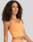 Angled front view of sherbet ladder back longline sports bra Athlesi