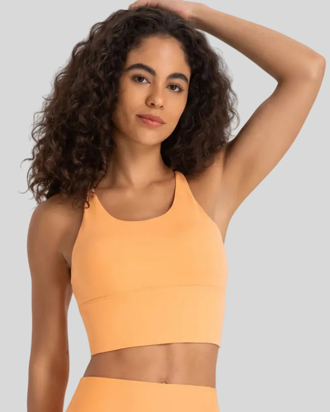 StrataLuxe ladder back sports bra in sherbet front view longline design