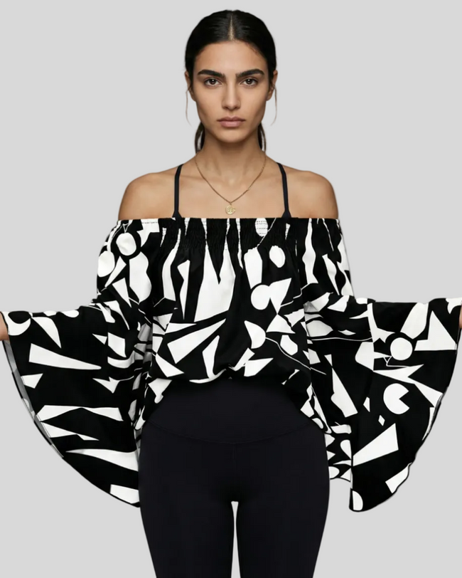 StreetBloom off-shoulder blouse in black styled with black Athlesi leggings front view