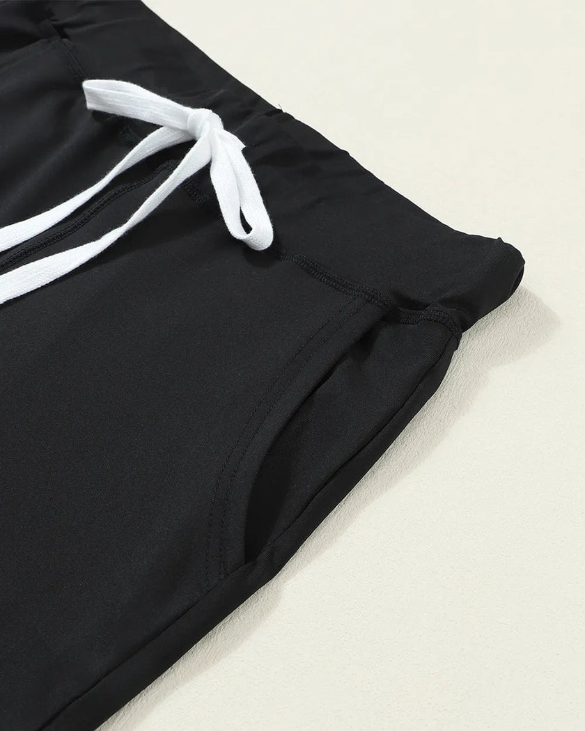 Close-up of drawstring waistband and pocket on black Athlesi StreetFlow Jogger Pant