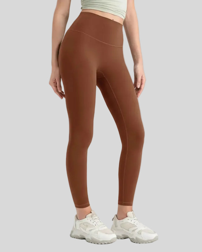 StrideSculpt Core Legging in caramel shown from front angle
