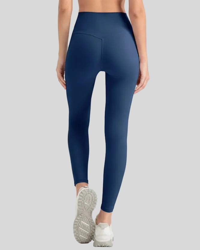 Back view of Athlesi StrideSculpt Slim Legging in dark blue