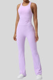 Athlesi StudioCross Sculpt & Flow Jumpsuit in blush pink with wide straps and sculpting fit, front view
