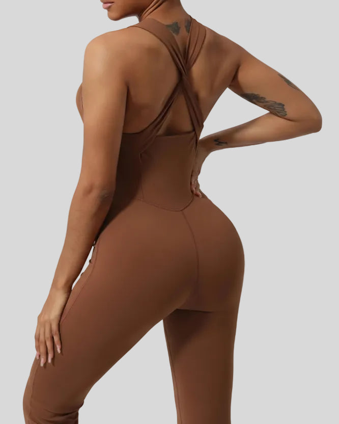Close-up of Athlesi StudioCross Sculpt & Flow Jumpsuit fabric and crisscross back detail in brown