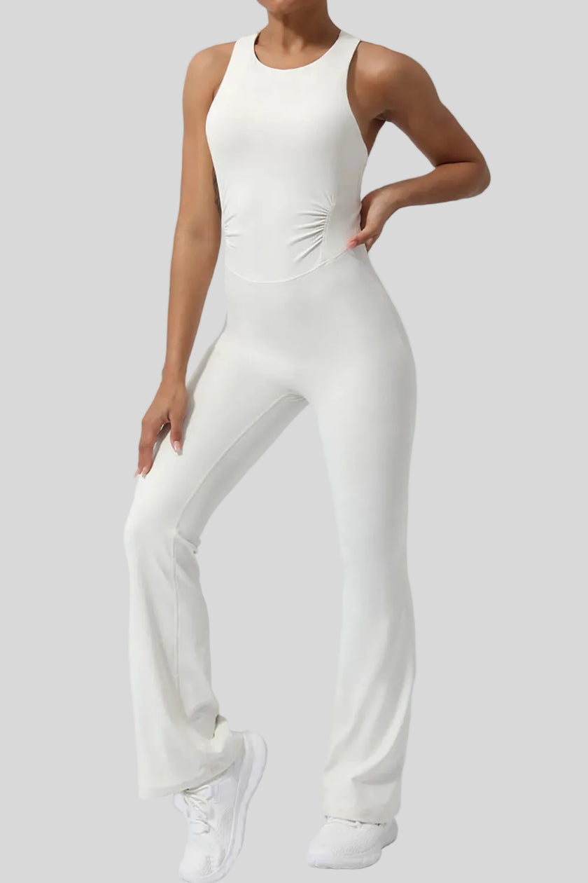 Athlesi StudioCross Sculpt & Flow Jumpsuit in white showing fluid pant silhouette, front angle view