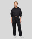 Full body front view of woman wearing Black StudioEase Cropped Hoodie with matching sweatpants