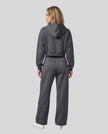 Full body back view of woman wearing Charcoal Gray StudioEase Cropped Hoodie with matching sweatpants