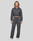 Full body front view of woman wearing Charcoal Gray StudioEase Cropped Hoodie with matching sweatpants