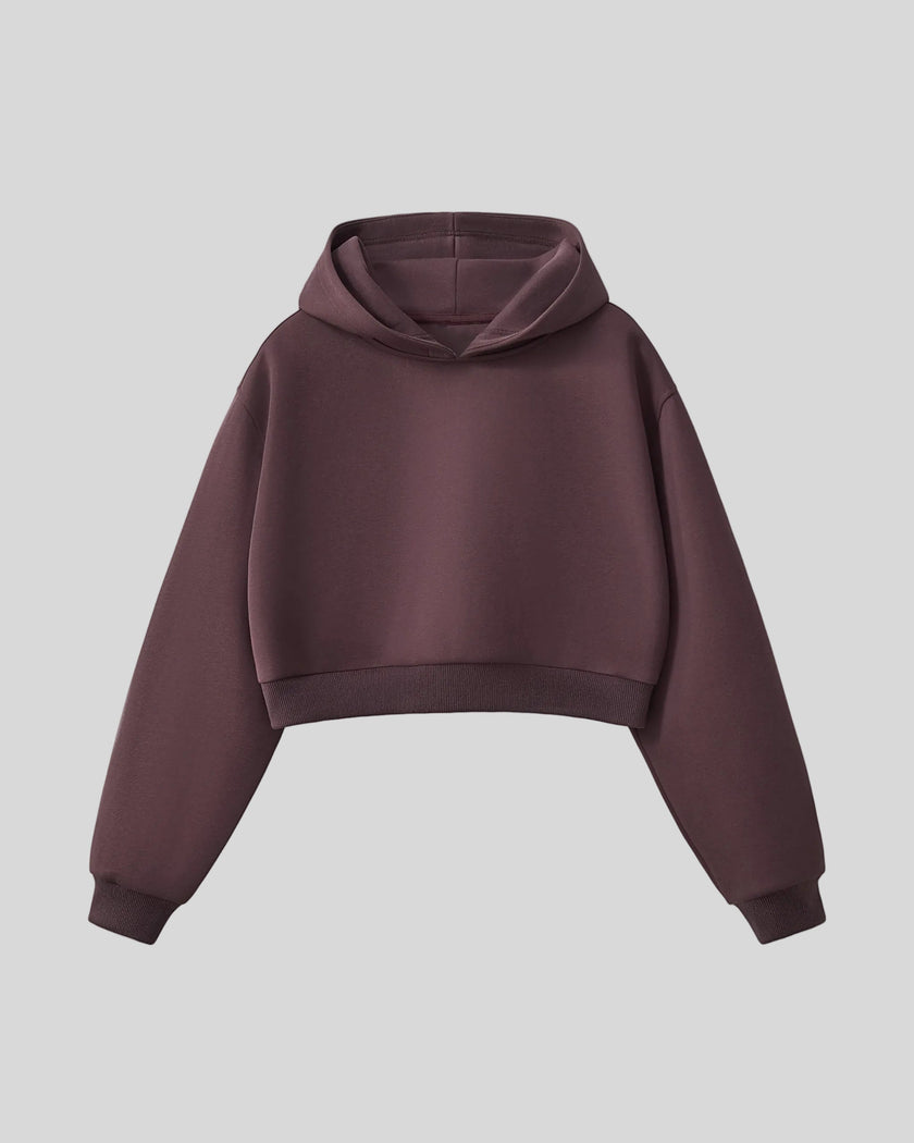 StudioEase Cropped Hoodie in Dark Reddish Purple with relaxed sleeves and ribbed hem, front view