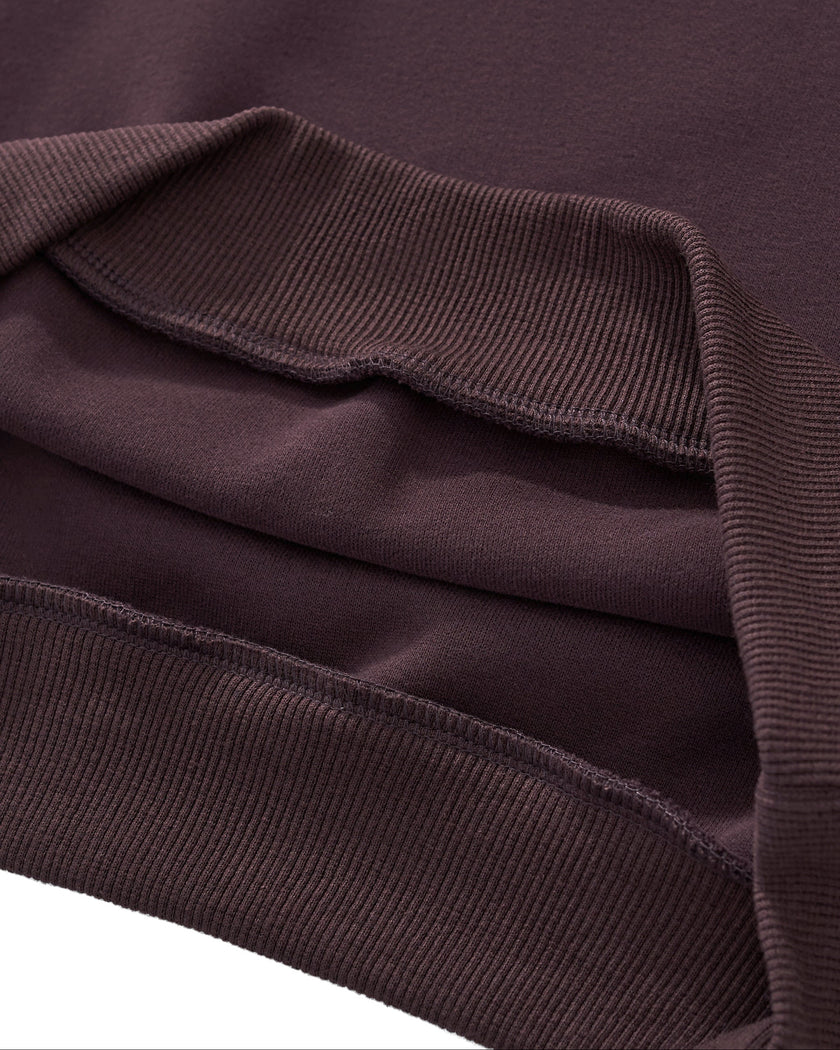 Closeup of wide ribbed hem and cropped construction on StudioEase Cropped Hoodie