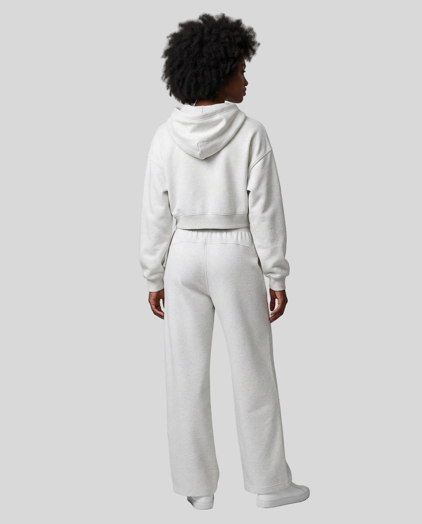 Full body back view of woman wearing Flower Gray StudioEase Cropped Hoodie with matching sweatpants