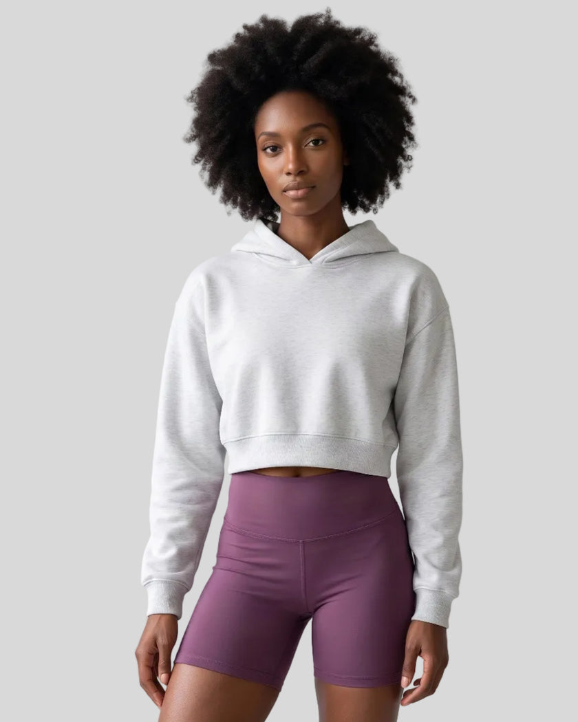 Upper body front view of woman wearing StudioEase Cropped Hoodie in Flower Gray