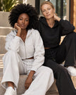Two women wearing two versions of Athlesi StudioEase Matching Pieces in Flower Gray and Black