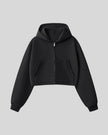 Front view of StudioEase Cropped Zip Hoodie in Black with full zipper and front pockets