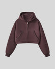 Front view of StudioEase Cropped Zip Hoodie in Dark Reddish Purple with full zipper and front pockets