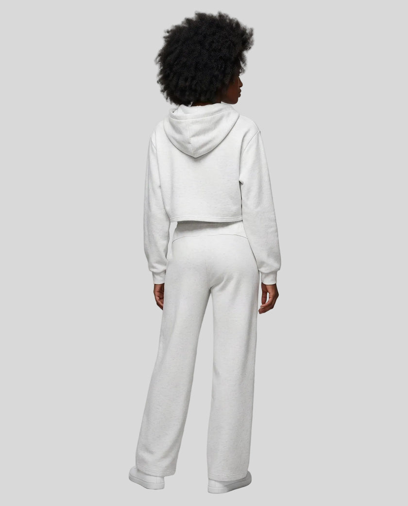 Full body back view of woman wearing flower gray StudioEase Cropped Zip Hoodie in a coordinated casual outfit