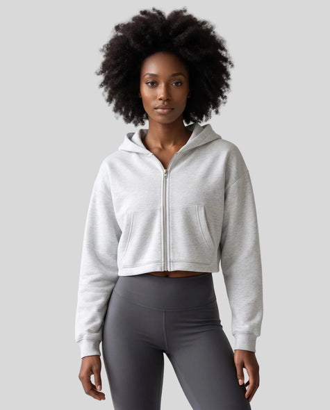 Upper body front view of woman wearing StudioEase Cropped Zip Hoodie zipped closed in Flower Gray