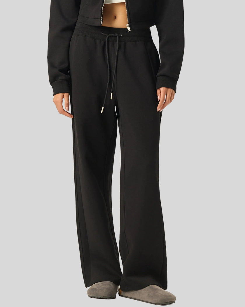 Angled lower body front view of woman wearing StudioEase Straight-Leg Sweatpants showing relaxed fit