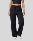 Lower body front view of woman wearing StudioEase Straight-Leg Sweatpants in Black