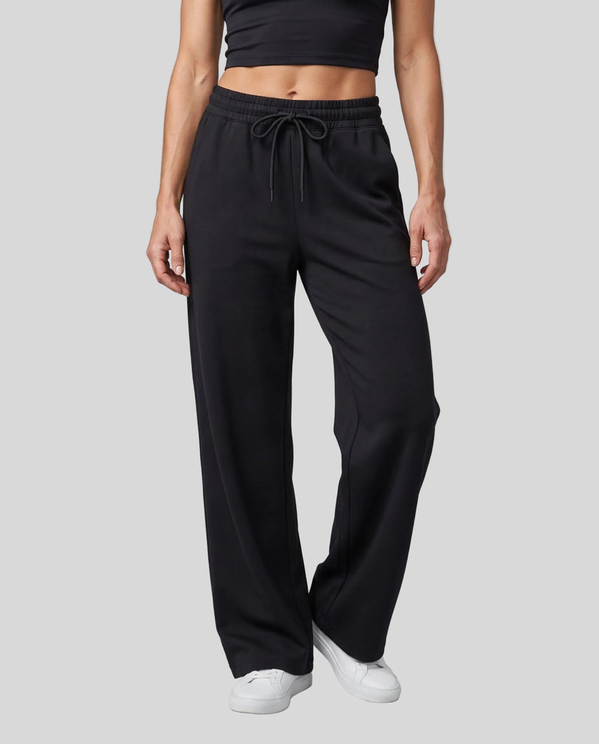Lower body front view of woman wearing StudioEase Straight-Leg Sweatpants in Black