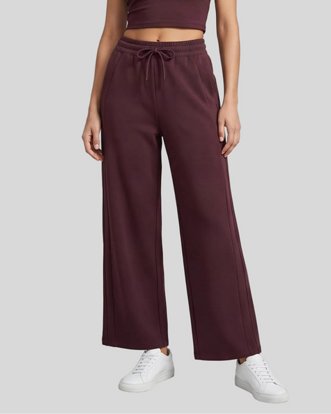 Lower body front view of woman wearing StudioEase Straight-Leg Sweatpants in Dark Reddish Purple