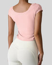 Back view of StudioFlow Short Sleeve Active Top in blush pink with smooth finish