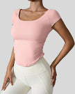 StudioFlow Short Sleeve Active Top in blush pink, front view with fitted silhouette