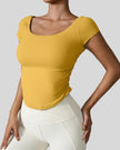 StudioFlow Short Sleeve Active Top in mustard, front view with fitted silhouette